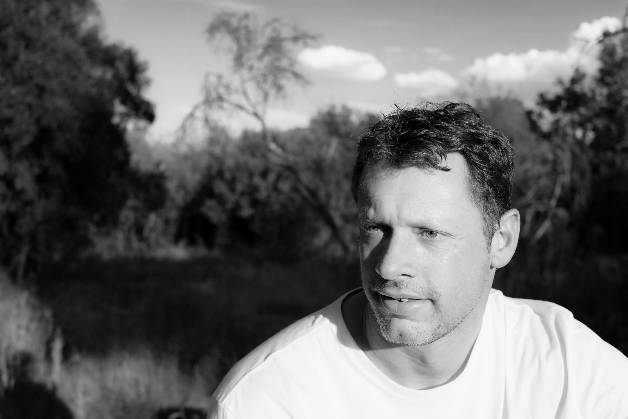 Portrait of Chris Cousens, black and white.