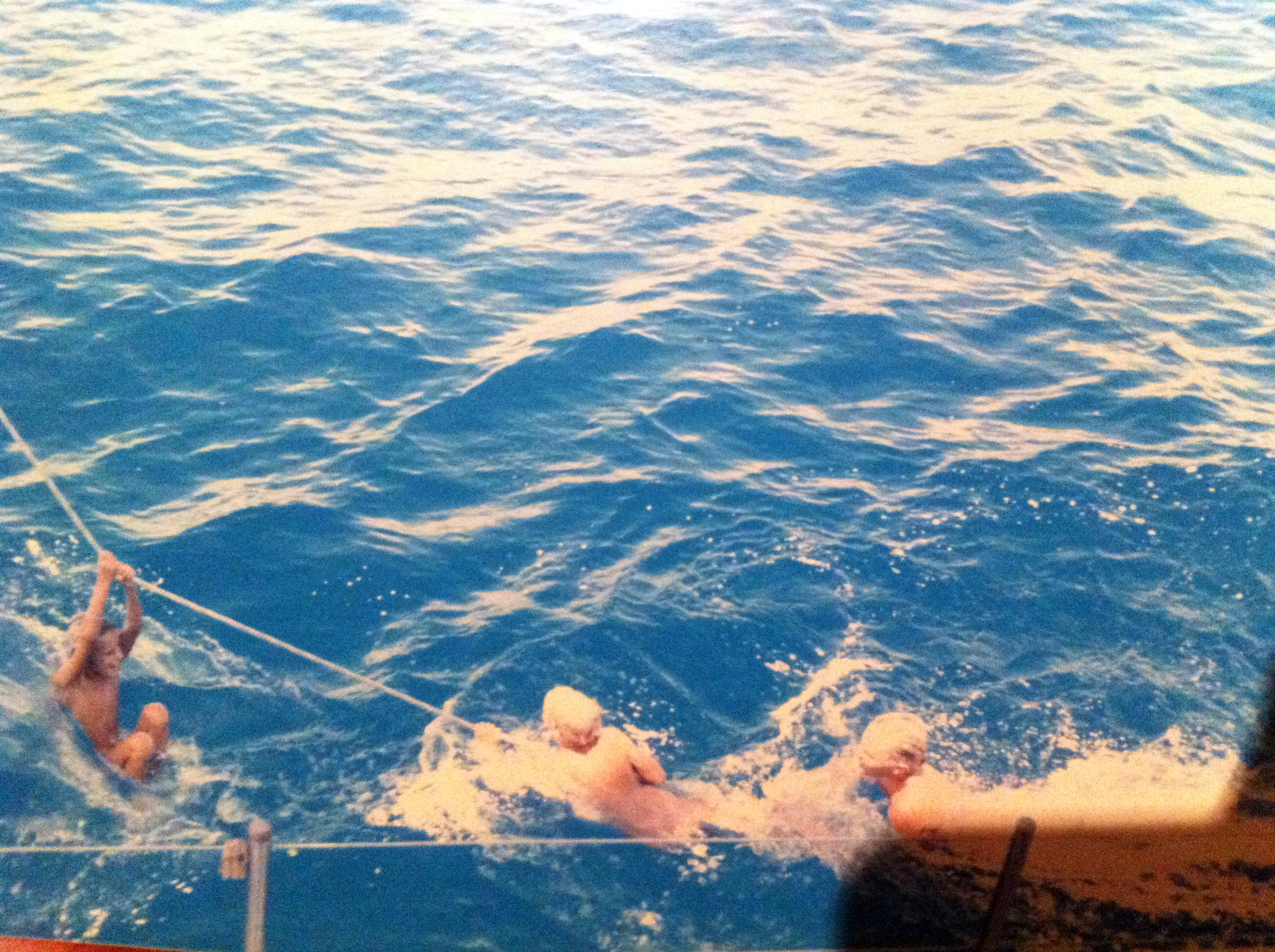 The children swimming alongside Chricanto.